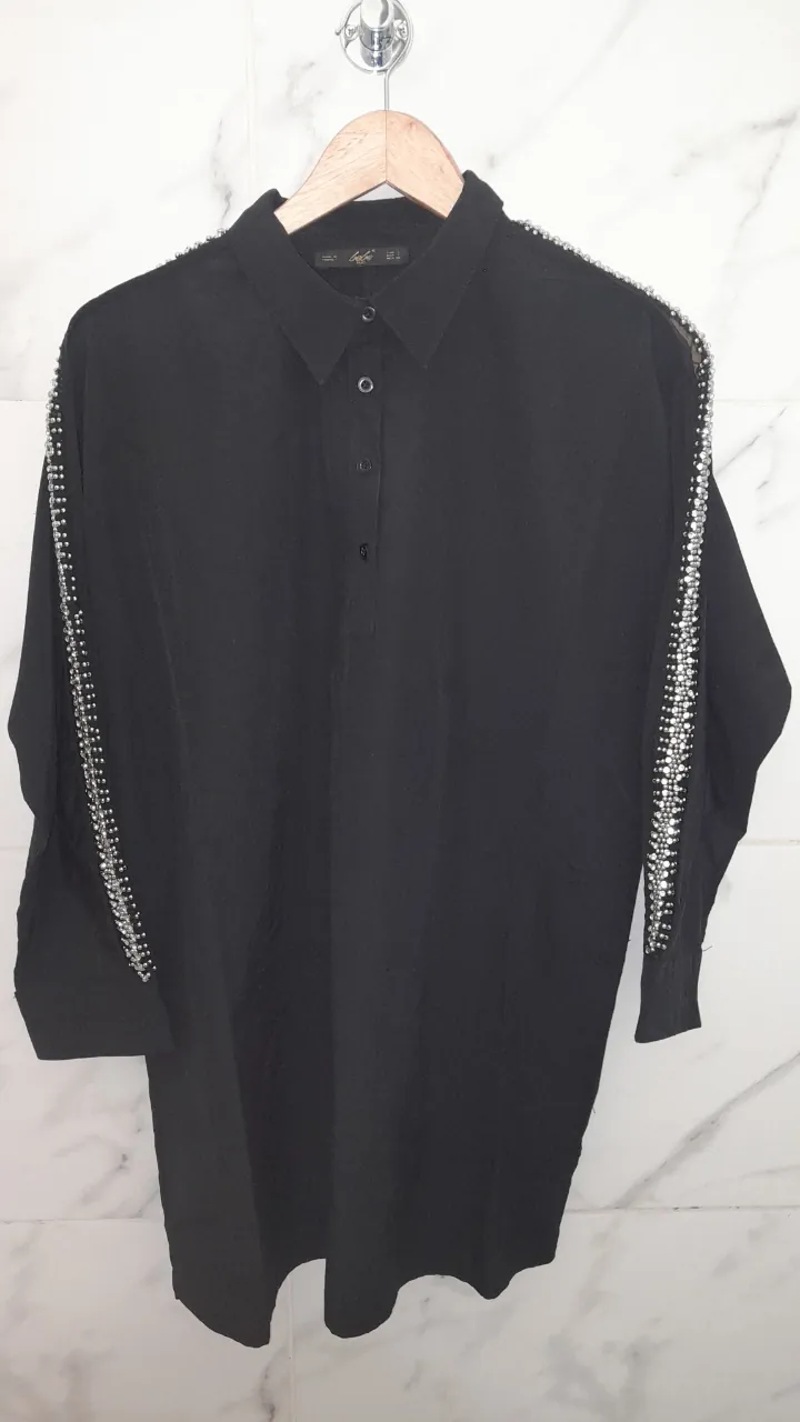 Blusa Bebe · Talle L