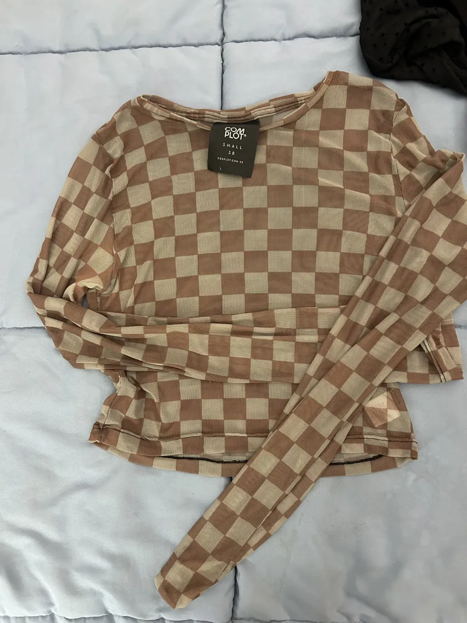 Remera Complot