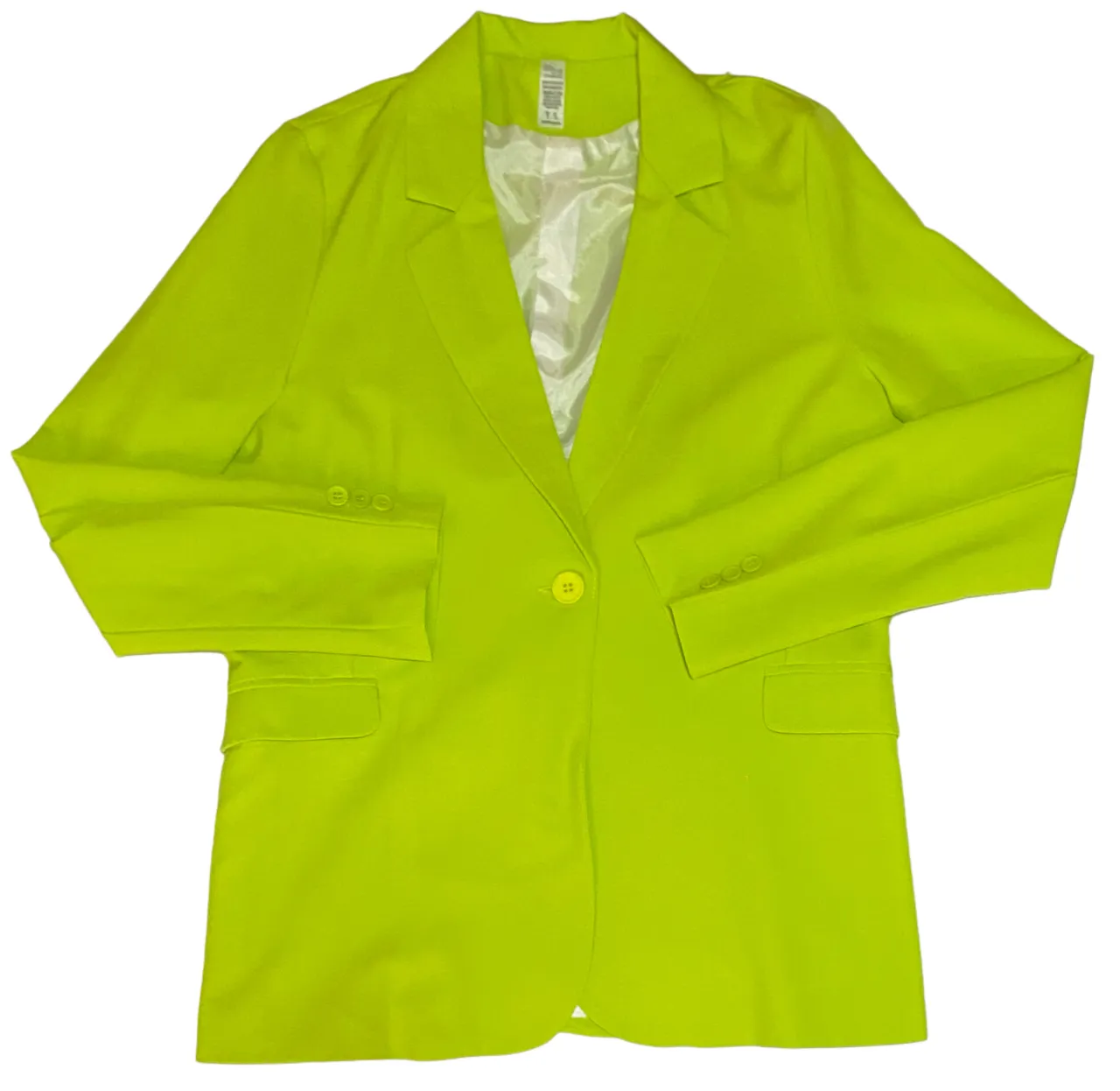Blazer de color verde lima con un botón al frente y bolsillos laterales. Posee forro interior blanco.
