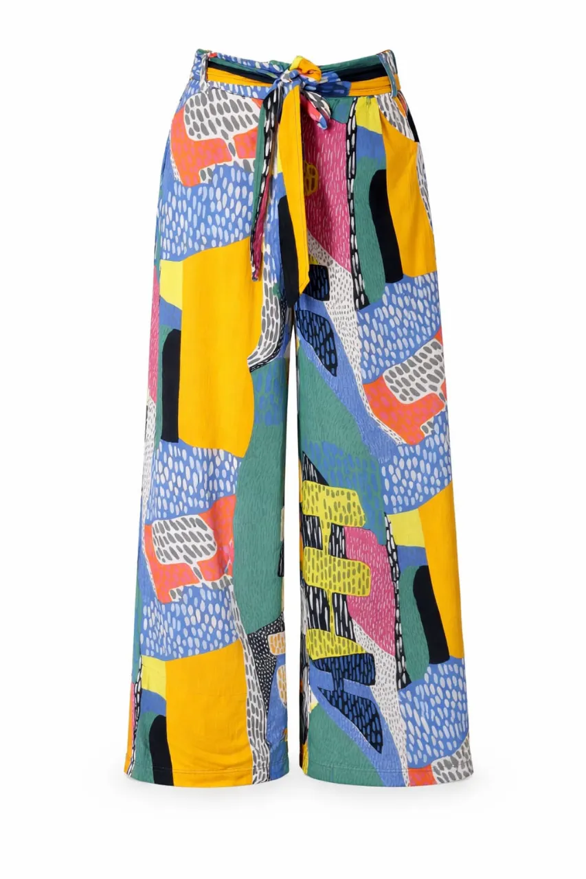 Pantalón ancho con estampado abstracto multicolor y lazo en la cintura.