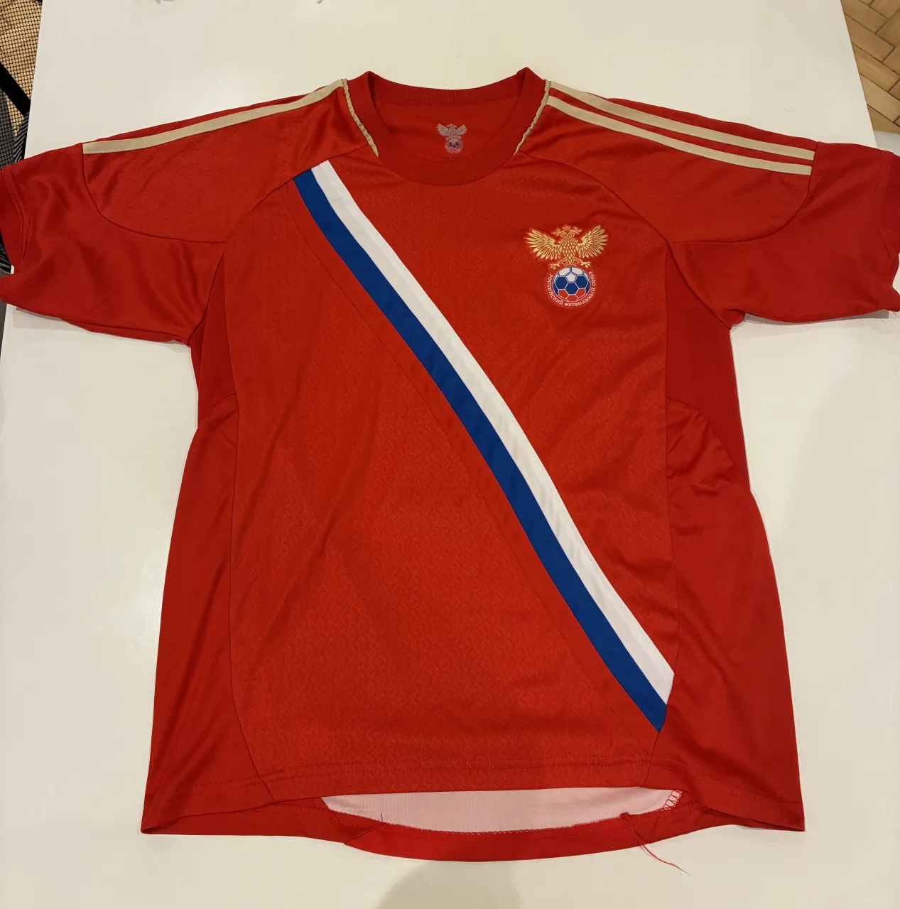 Camiseta A..